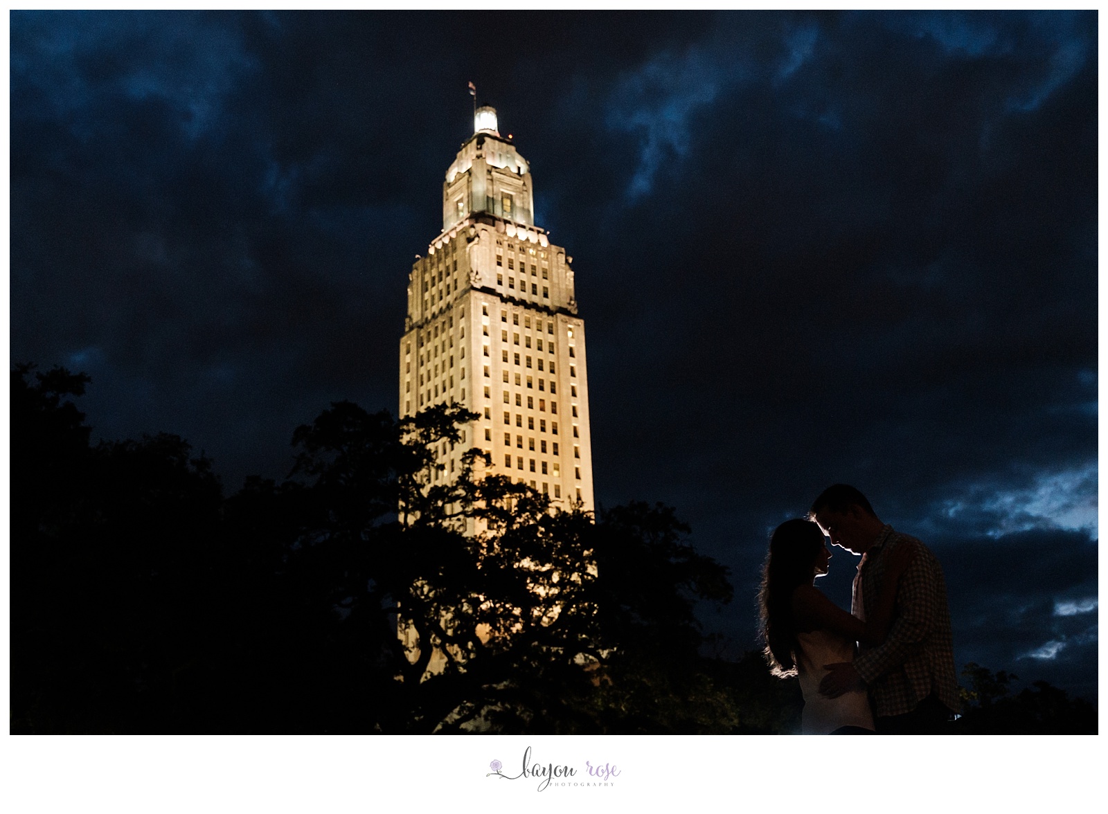 Couple silhouetted against capitol building