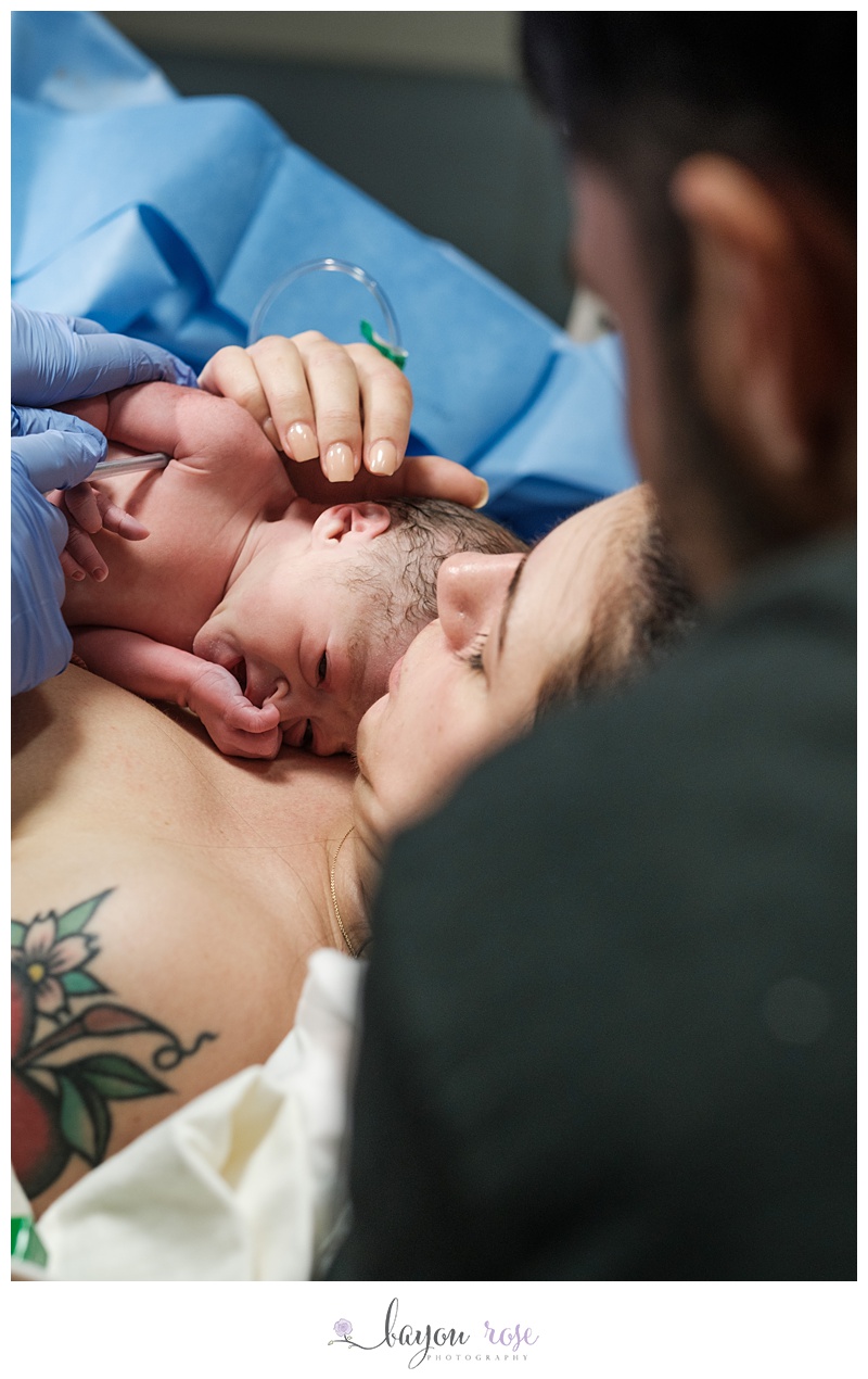 newborn baby on mom's chest