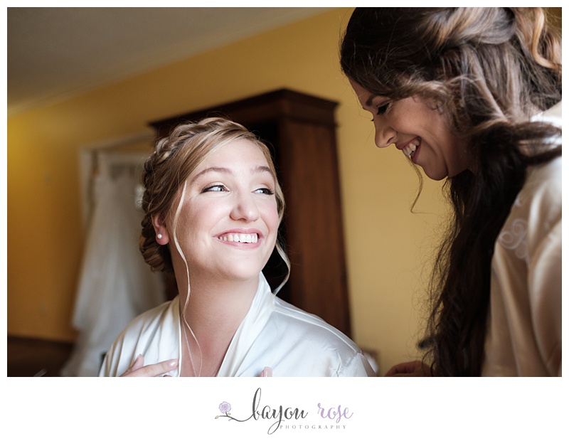 Image of bride laughing with bridesmaid