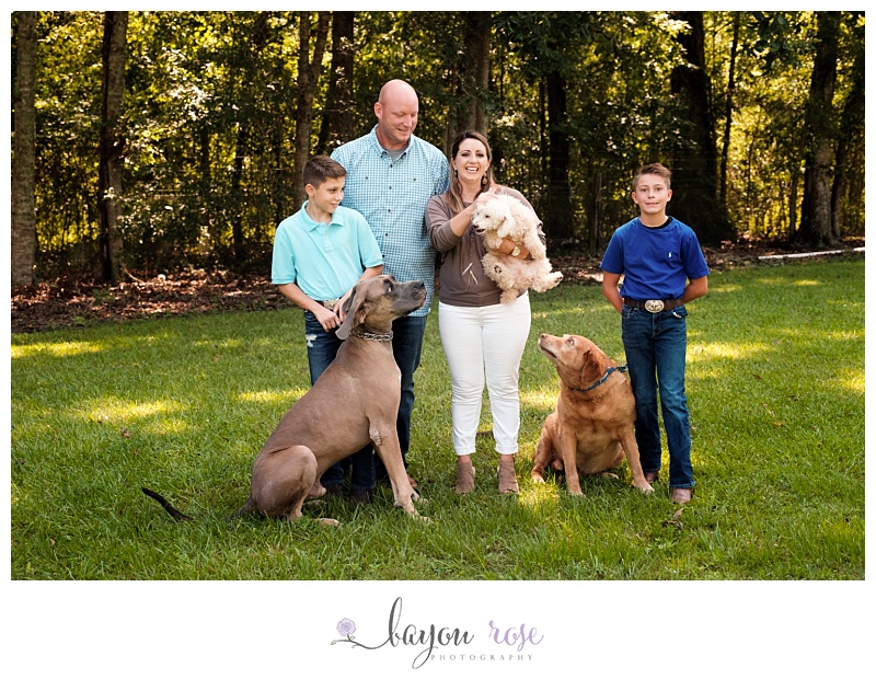 image of family with dogs with one dog snapping at others