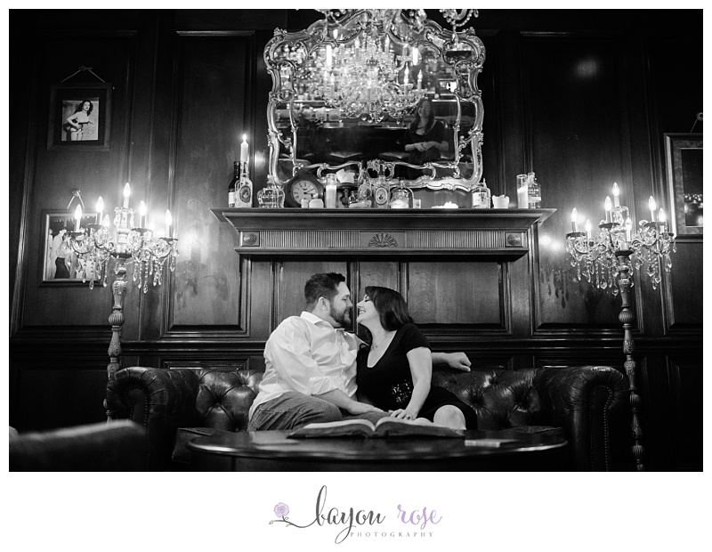 unique engagement photography session in whiskey bar under chandelier