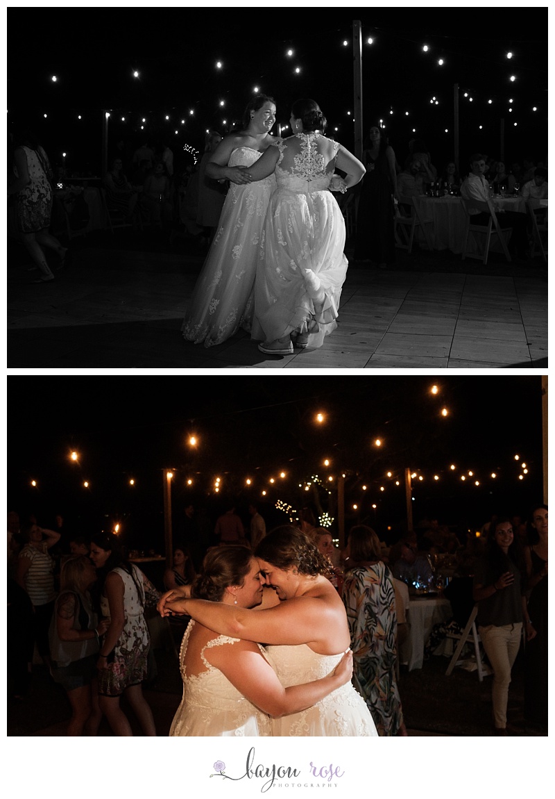 brides dancing under string lights at reception on Pensacola beach