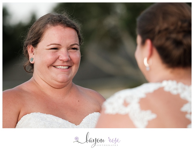 LGBTQ bride laughing at partner during ceremony
