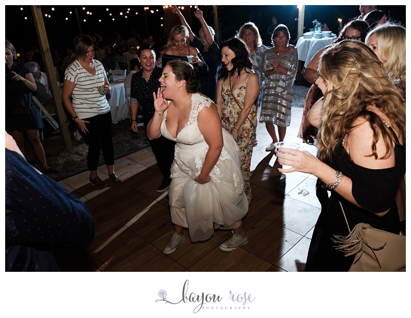bride singing to music and dancing at reception