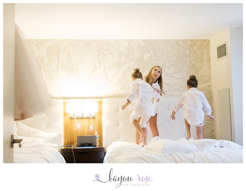 children jumping on hotel bed