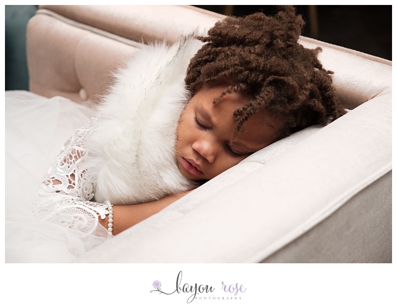flower girl sleeping at reception at Pavilion of Two Sisters New Orleans
