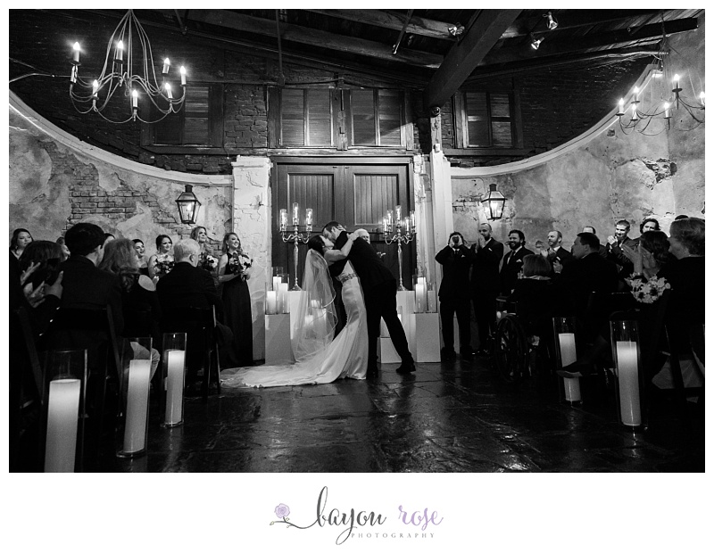 first kiss at Latrobe's On Royal by Bride and Groom
