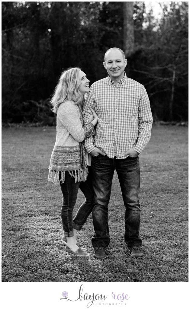 black and white image of couple posing for engagement photo in Baton Rouge