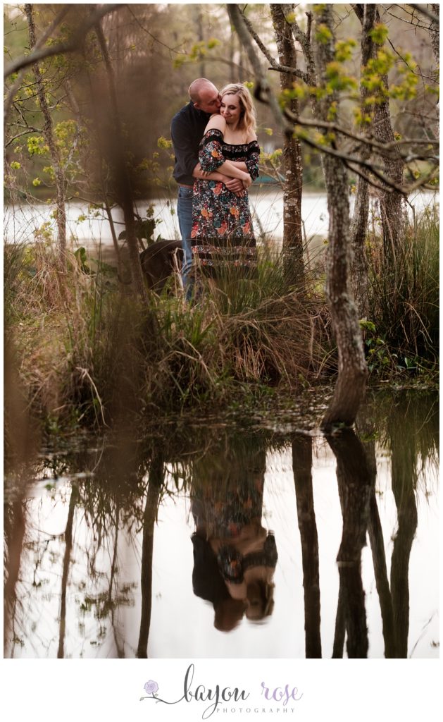 funny engagement photo of couple making funny faces while reflected in water