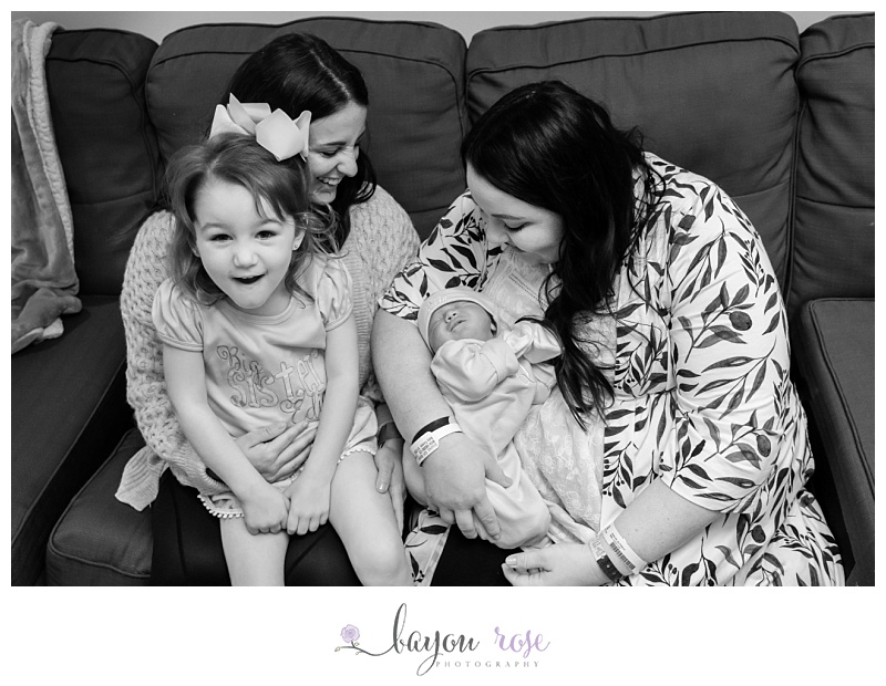 LGBTQ family photo with newborn baby girl