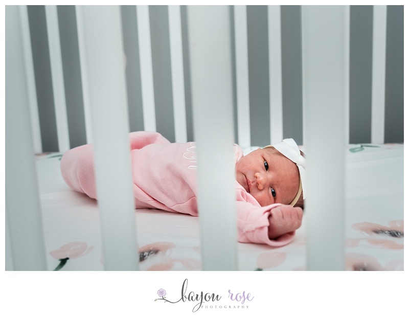 newborn baby girl in crib