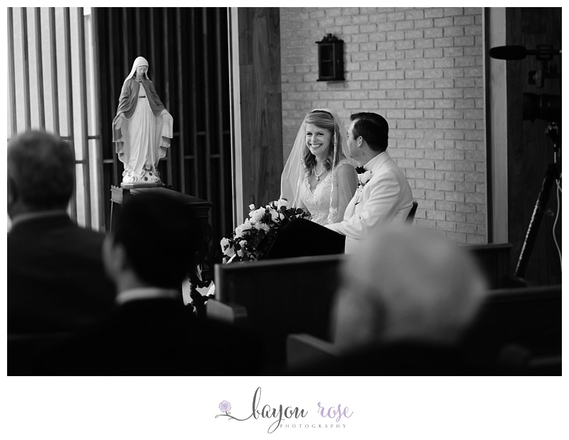 bride laughing during Catholic wedding ceremony in Baton Rouge