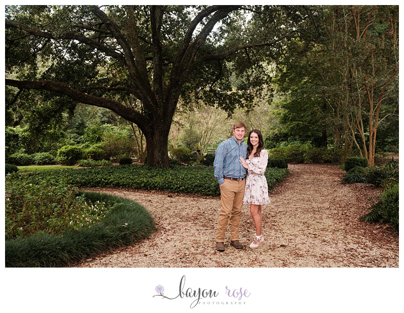 Engagement photo under big oak tree at Windrush Gardens in Baton Rouge