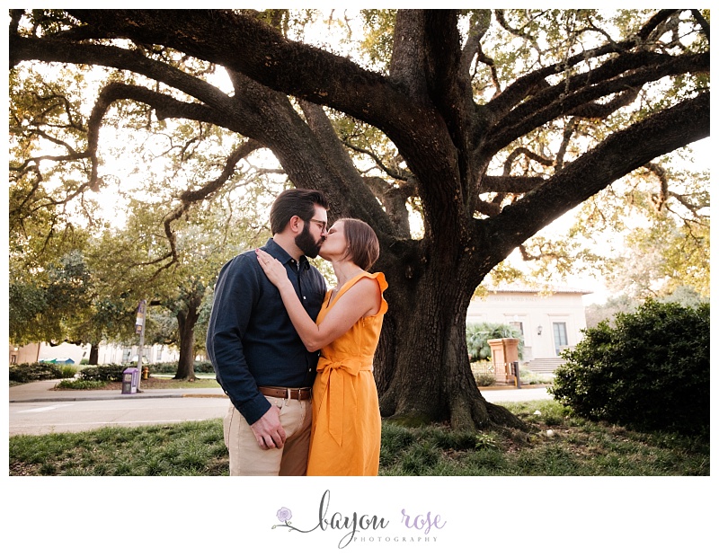 Couple kissing under oak tree at LSU