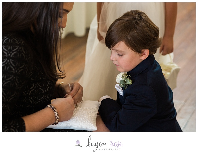 ring bearer getting ready for the ceremony