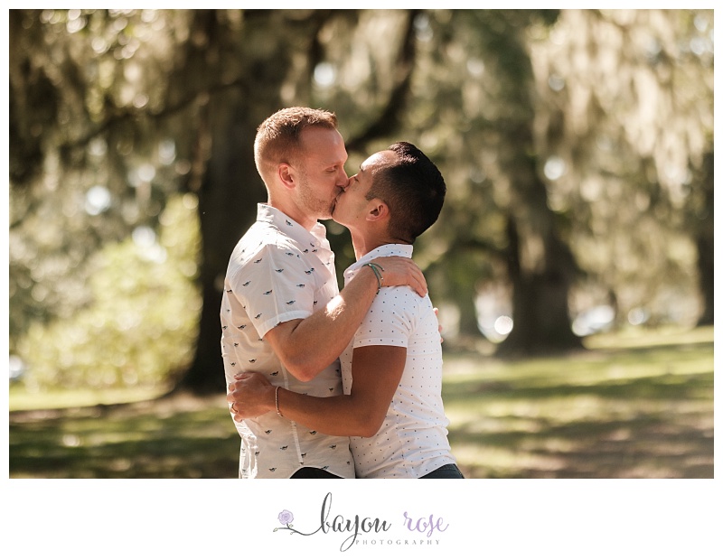 Gay couple kiss in City Park New Orleans