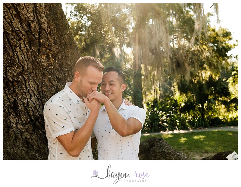 Sunset engagement photo of gay couple in New Orleans