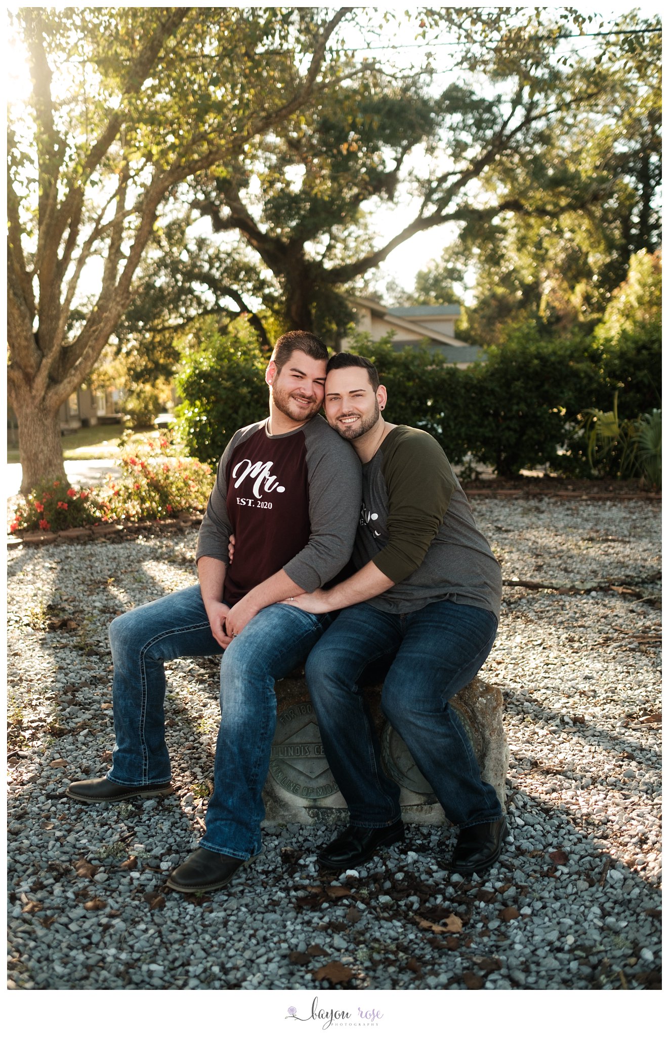 gay engagement photo in a park