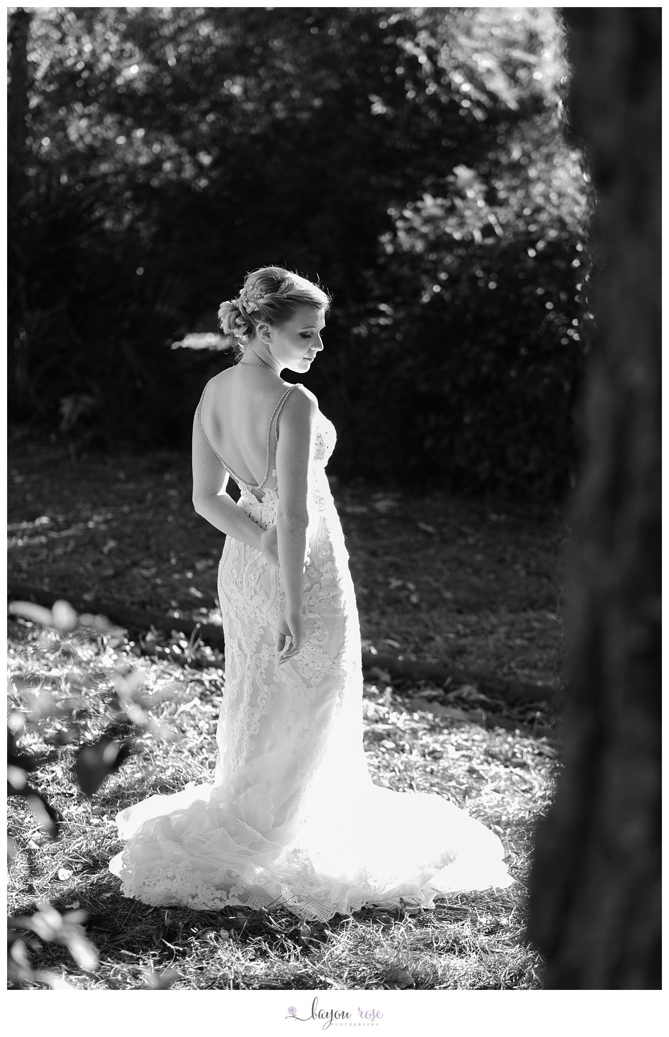 Bride in pocket of sunlight at The Oaks Ponchatoula