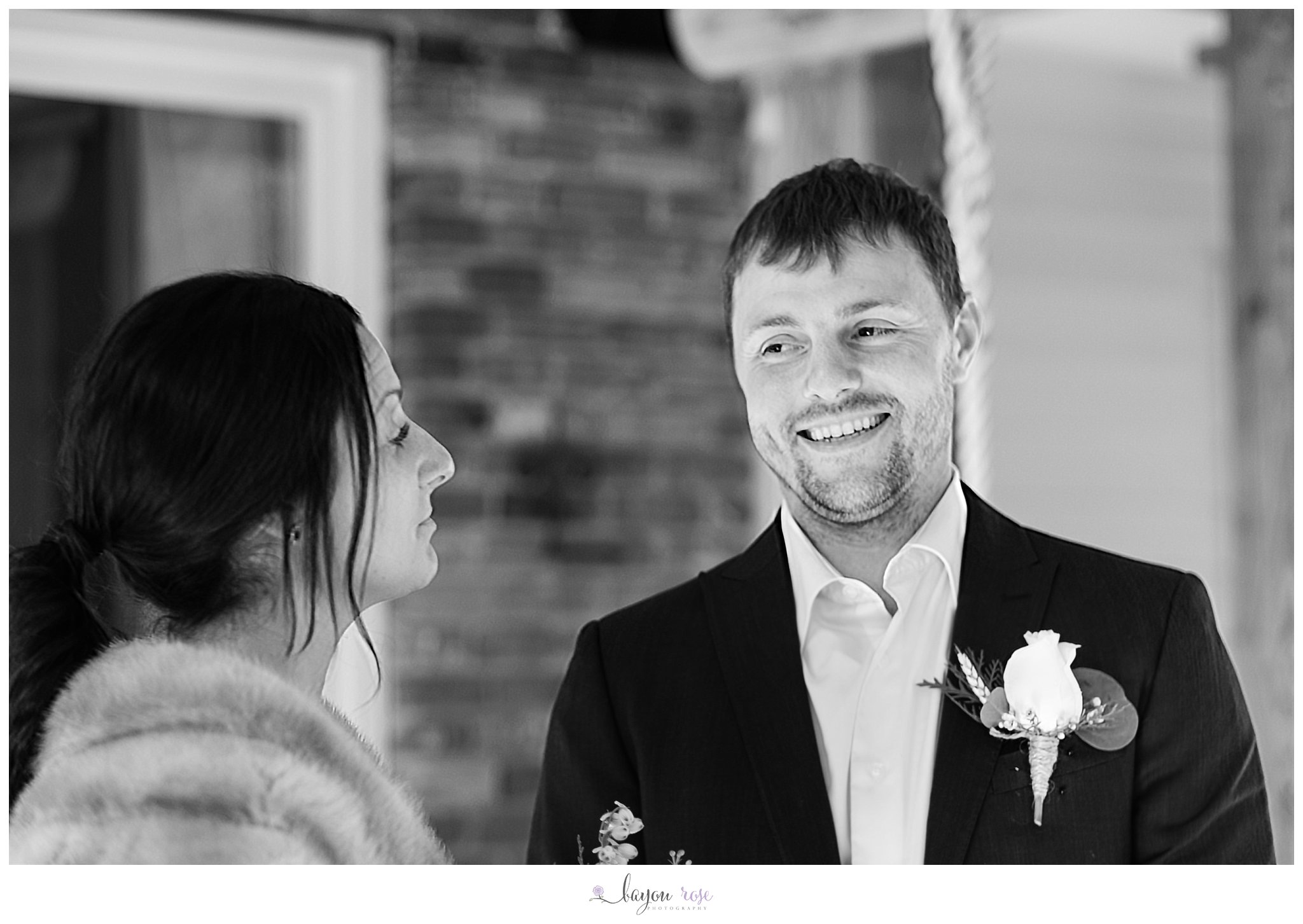 groom laughing during wedding ceremony