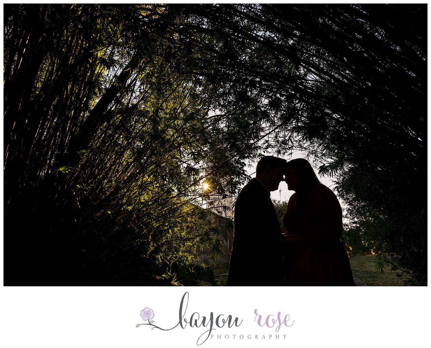 silhouette of engaged couple with Louisiana state capitol in the background