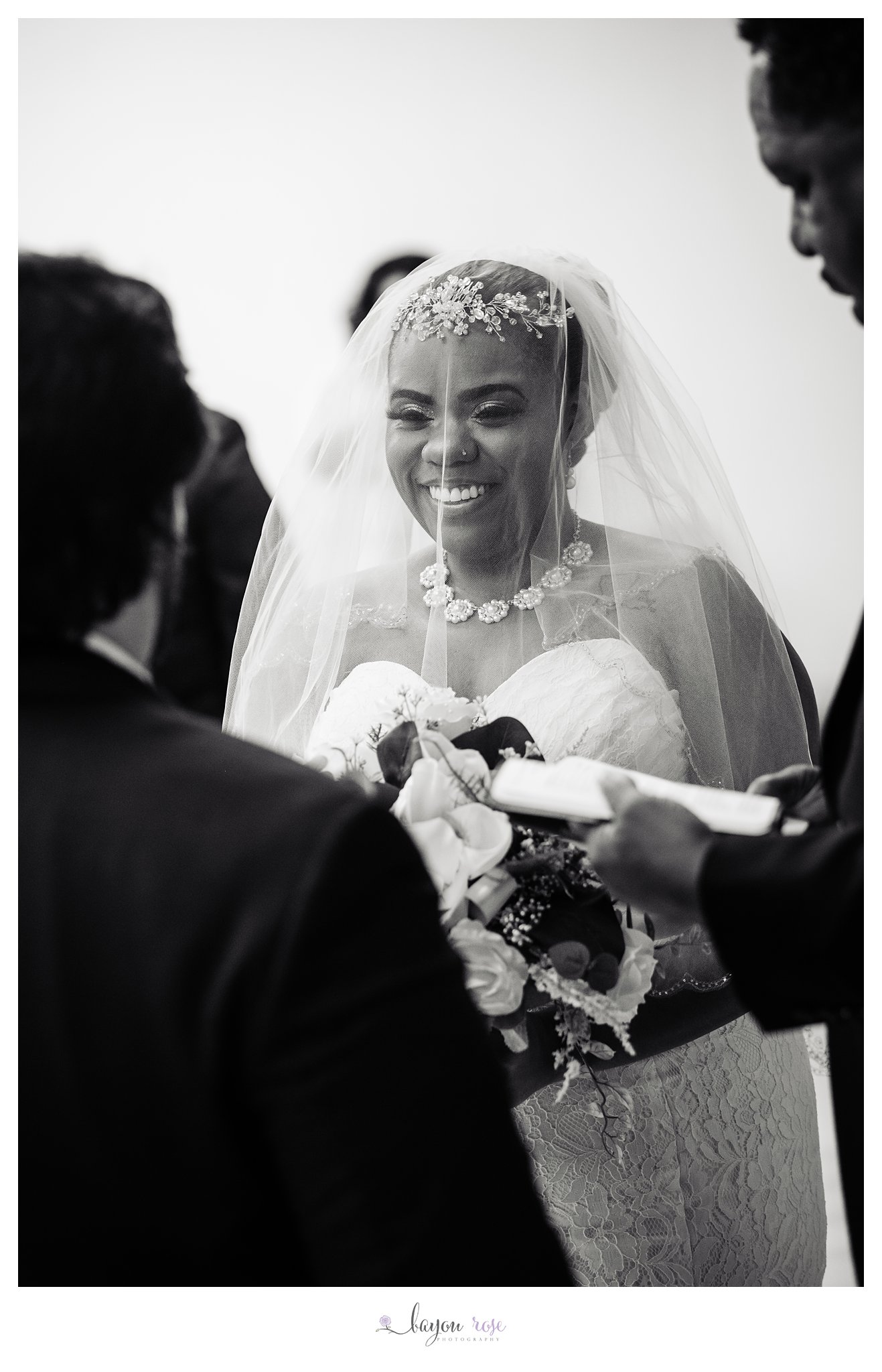 black and white image of bride in wedding veil