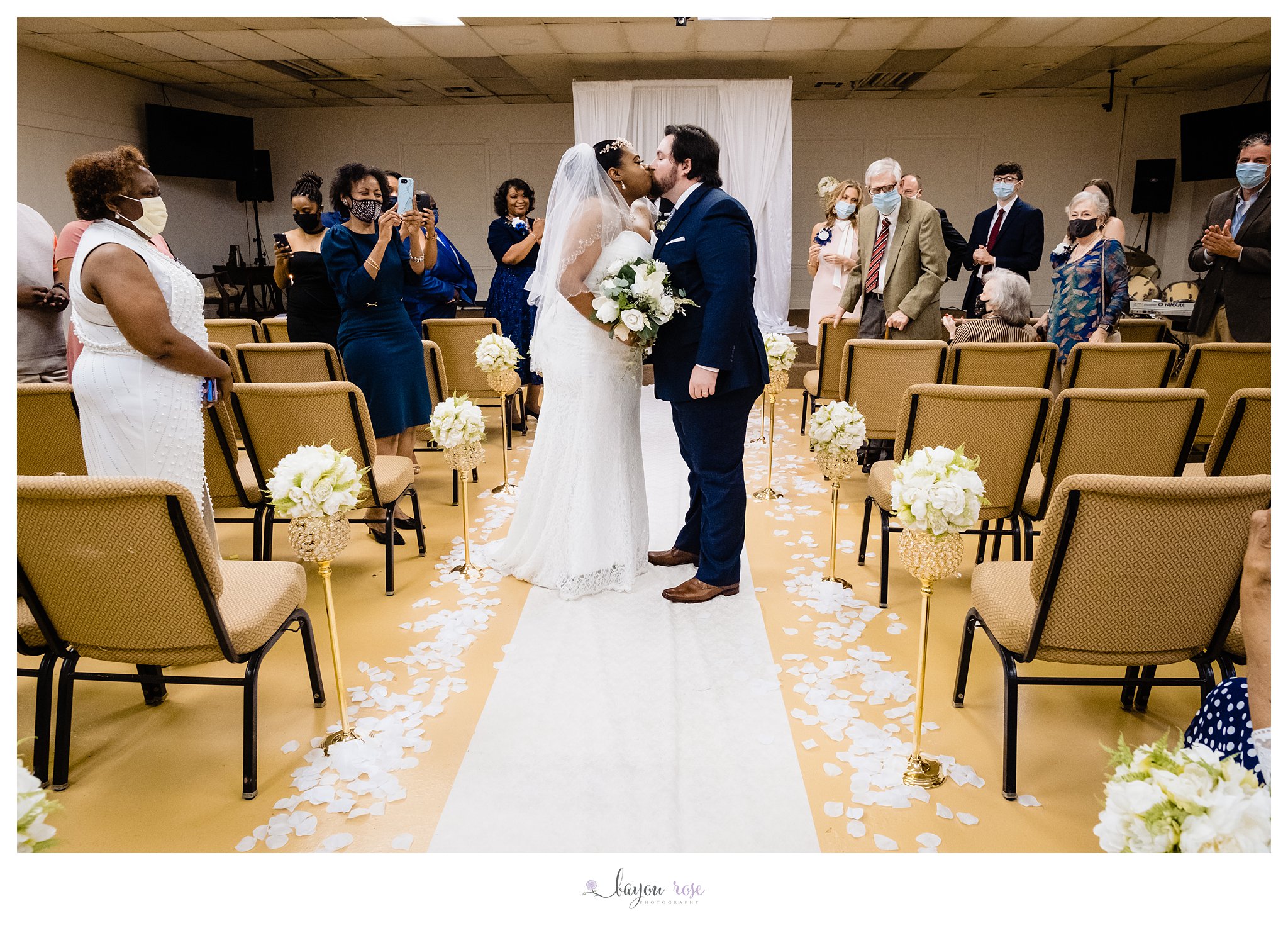 elopement wedding kiss in church aisle