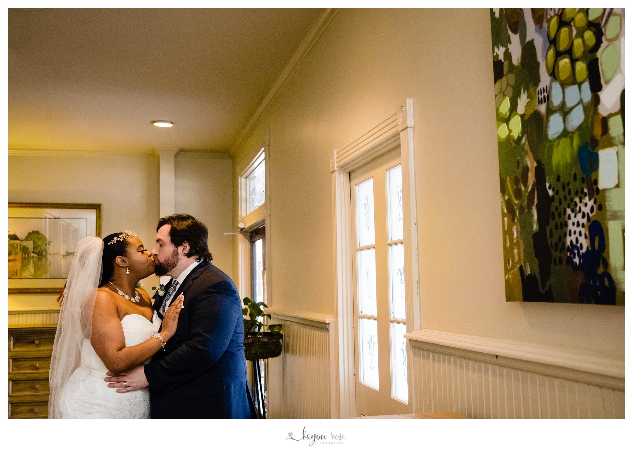 kissing bride and groom portrait after elopement in Baton Rouge