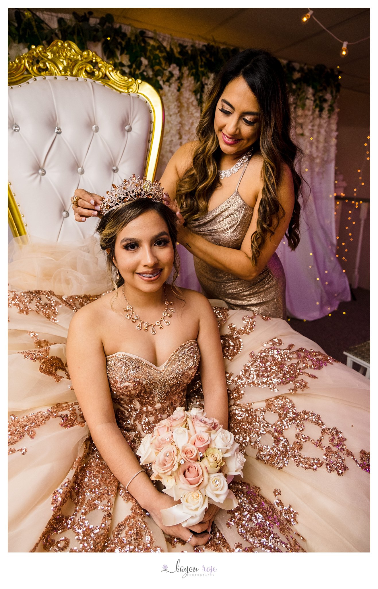 mom places crown on daughter's head for quinceanera