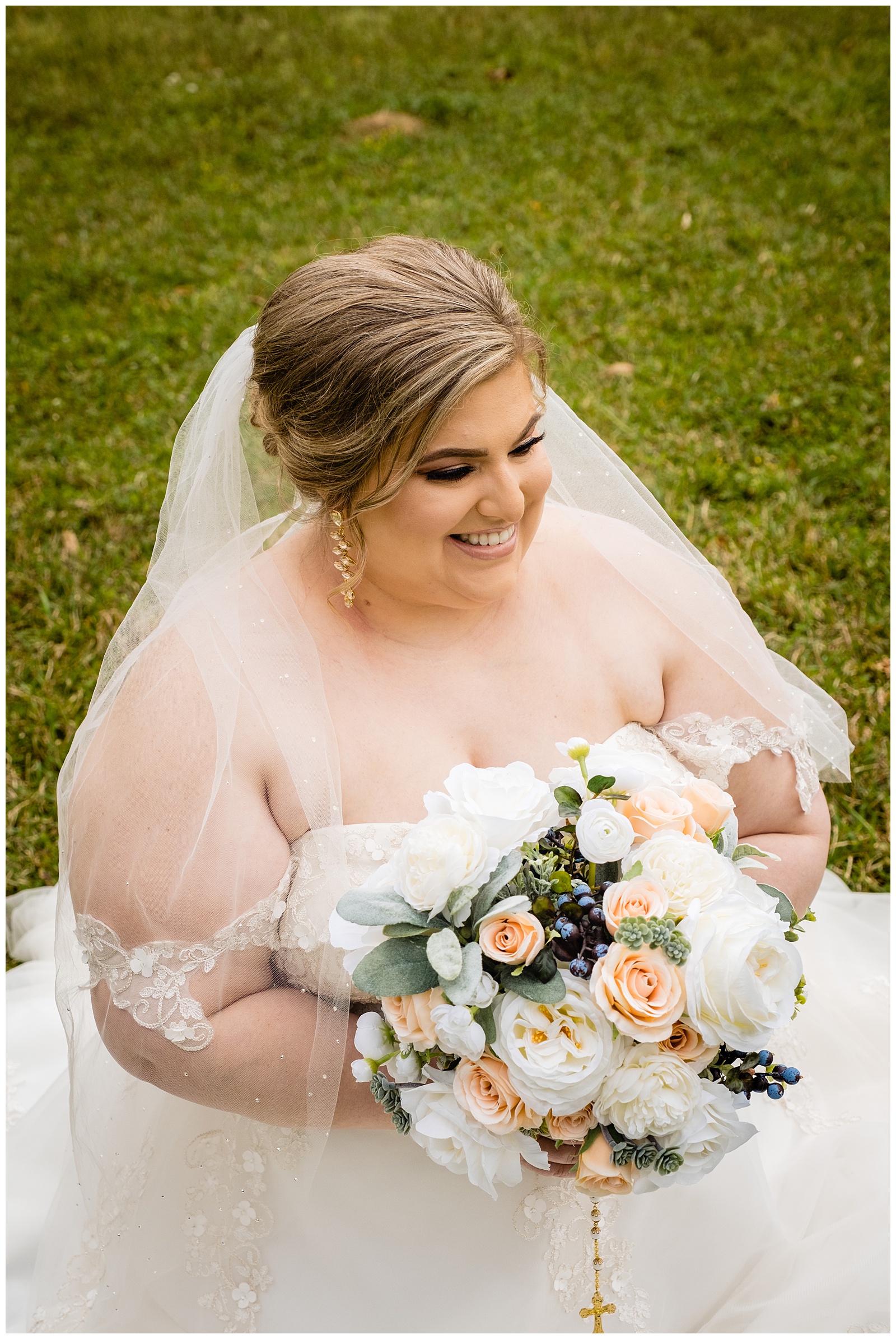 Barton Arboretum bridal photo of smiling bride holding bouquet