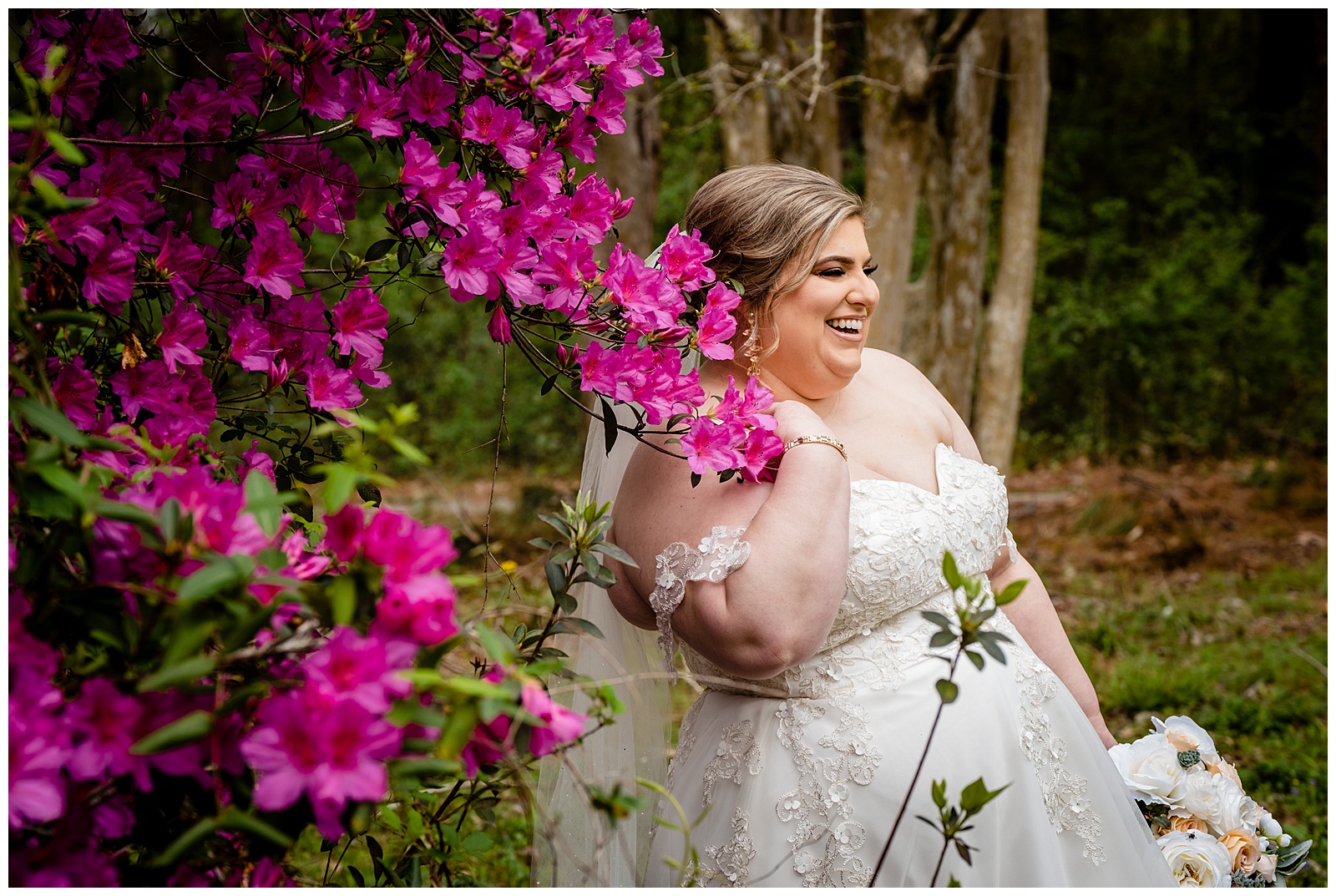 bridal photo of bride laughing in azalea bush near Barton Arboretum Trails