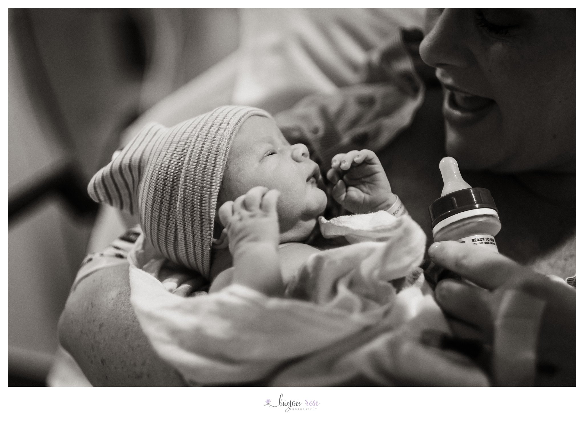 newborn looks at mom in birth photo