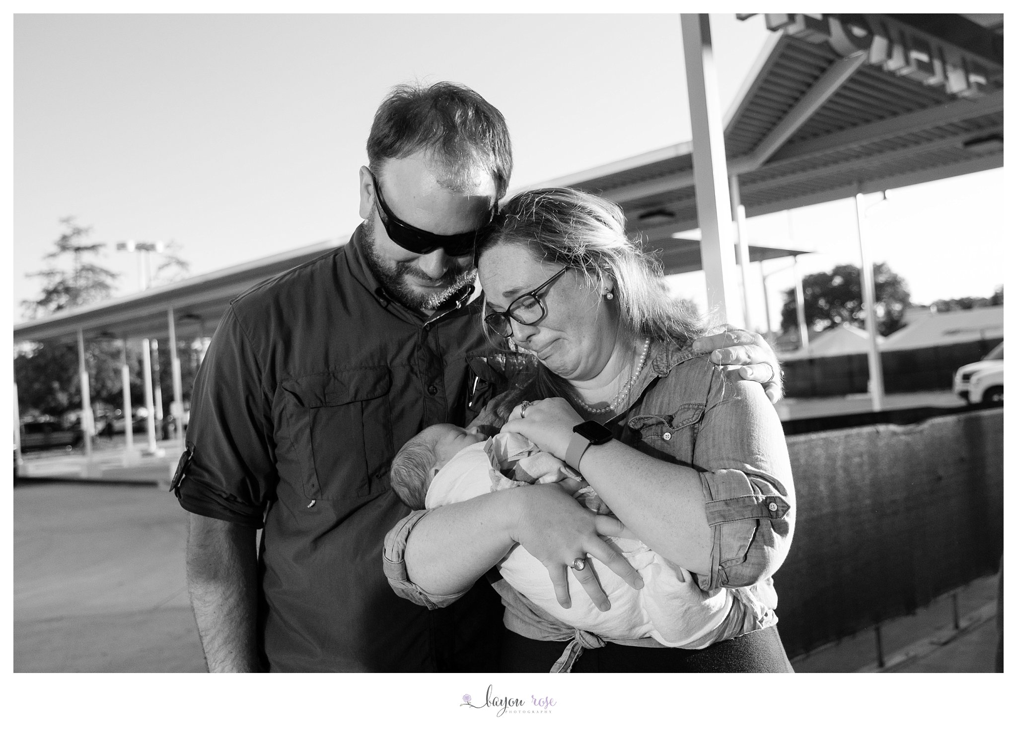 emotional photo of couple adopting a baby