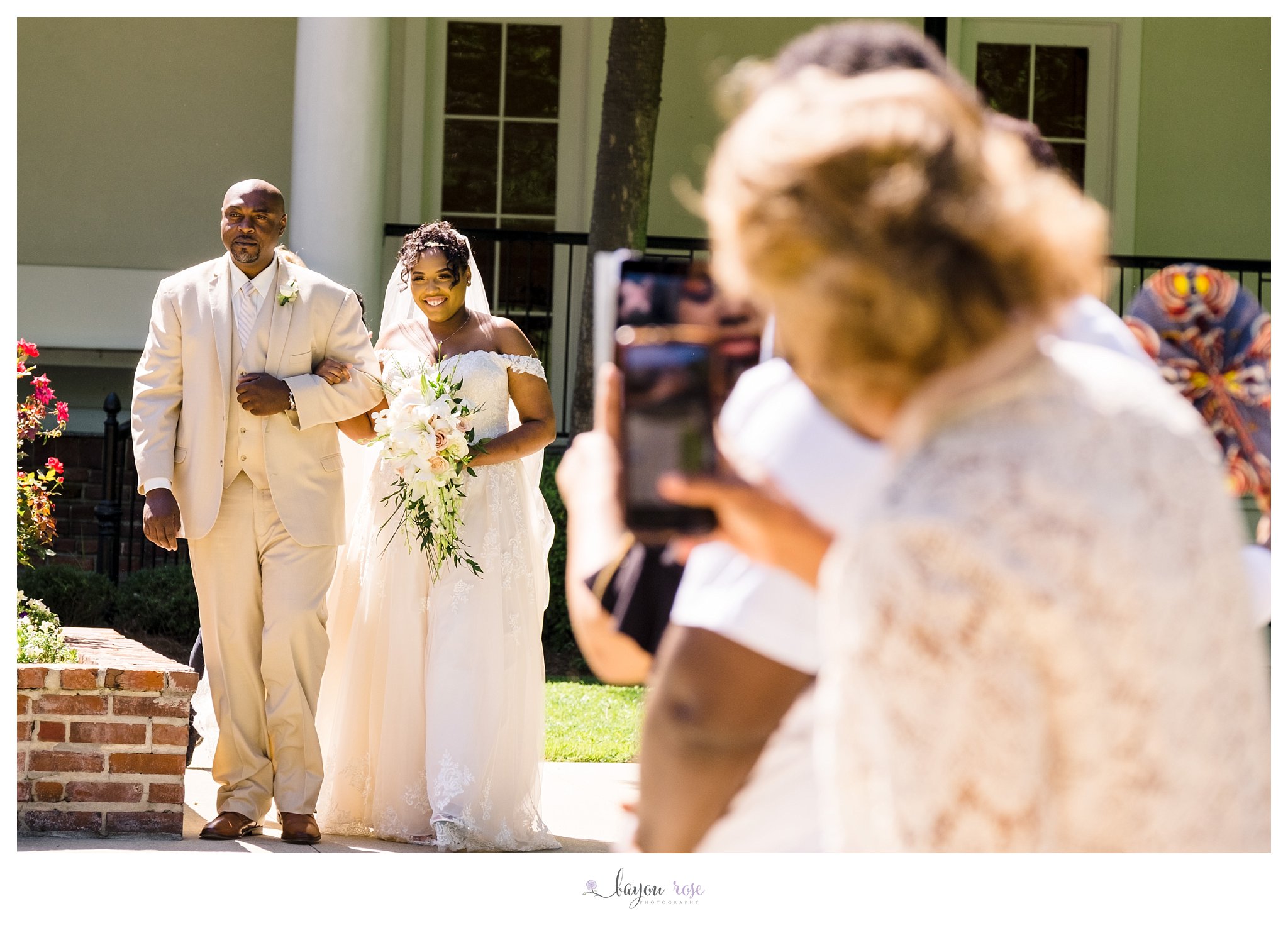 Bride walks down the aisle with her father