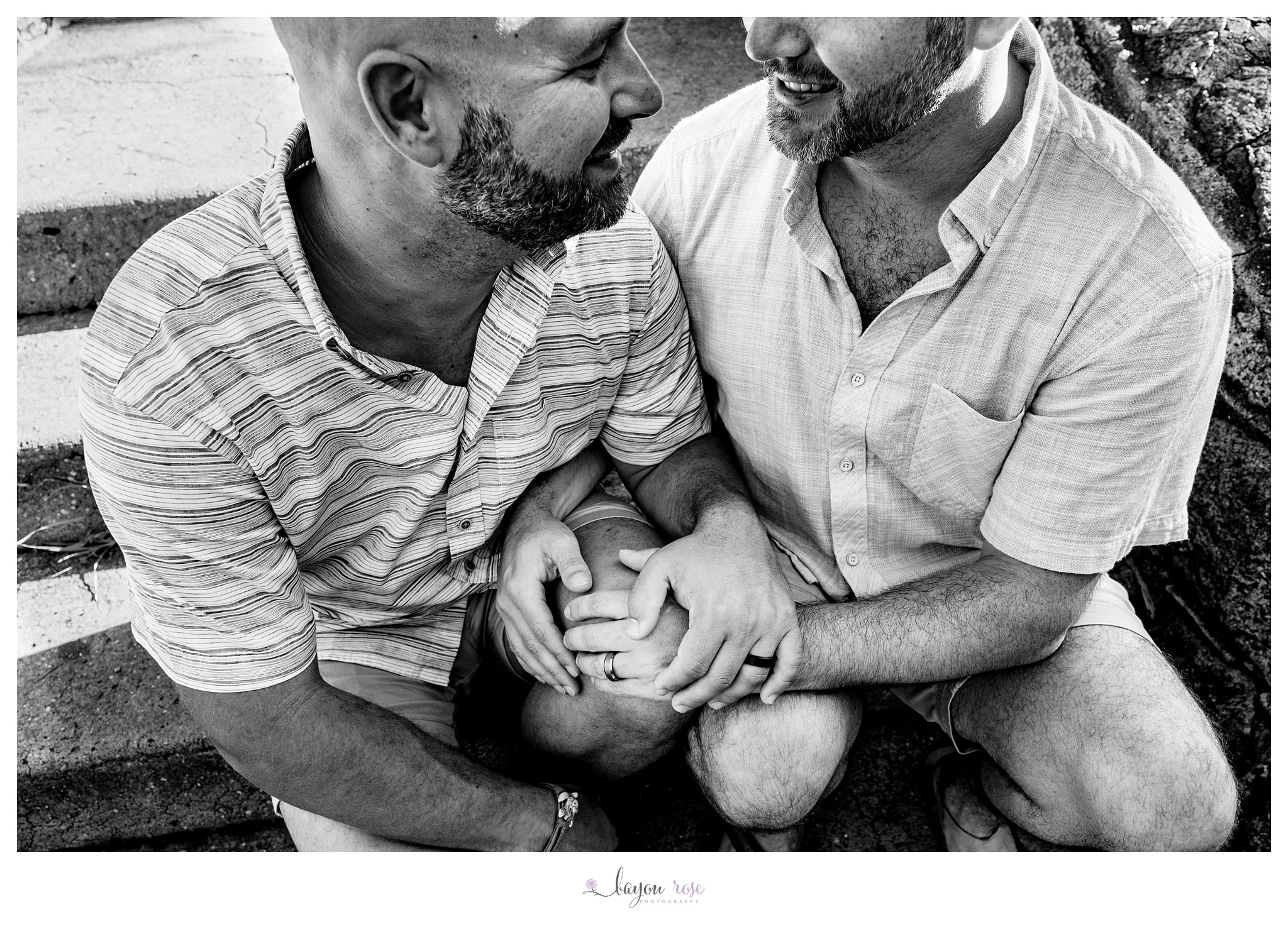 black and white photo of two guys holding hands for engagement photos in City Park