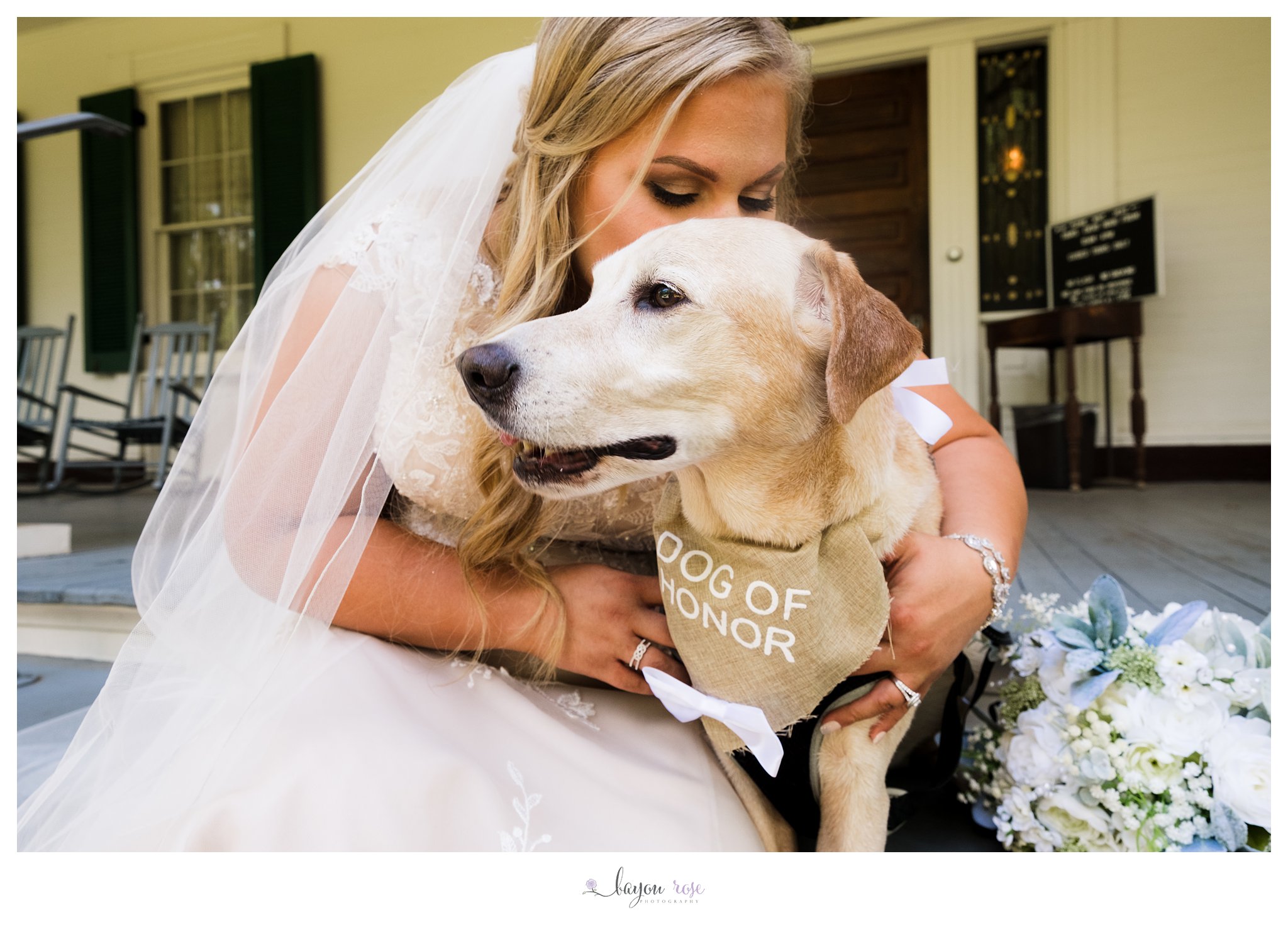 bride hugging dog in bridal photo