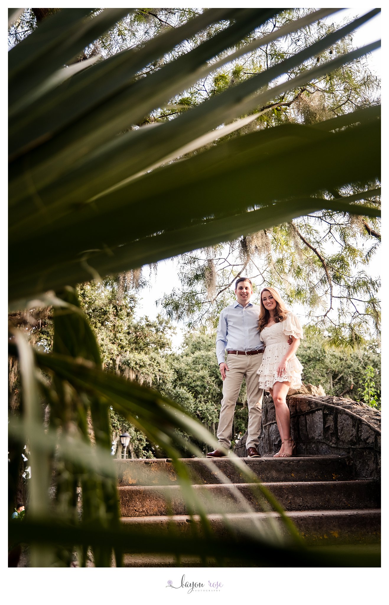 engagement photo in City Park New Orleans through palm fronds