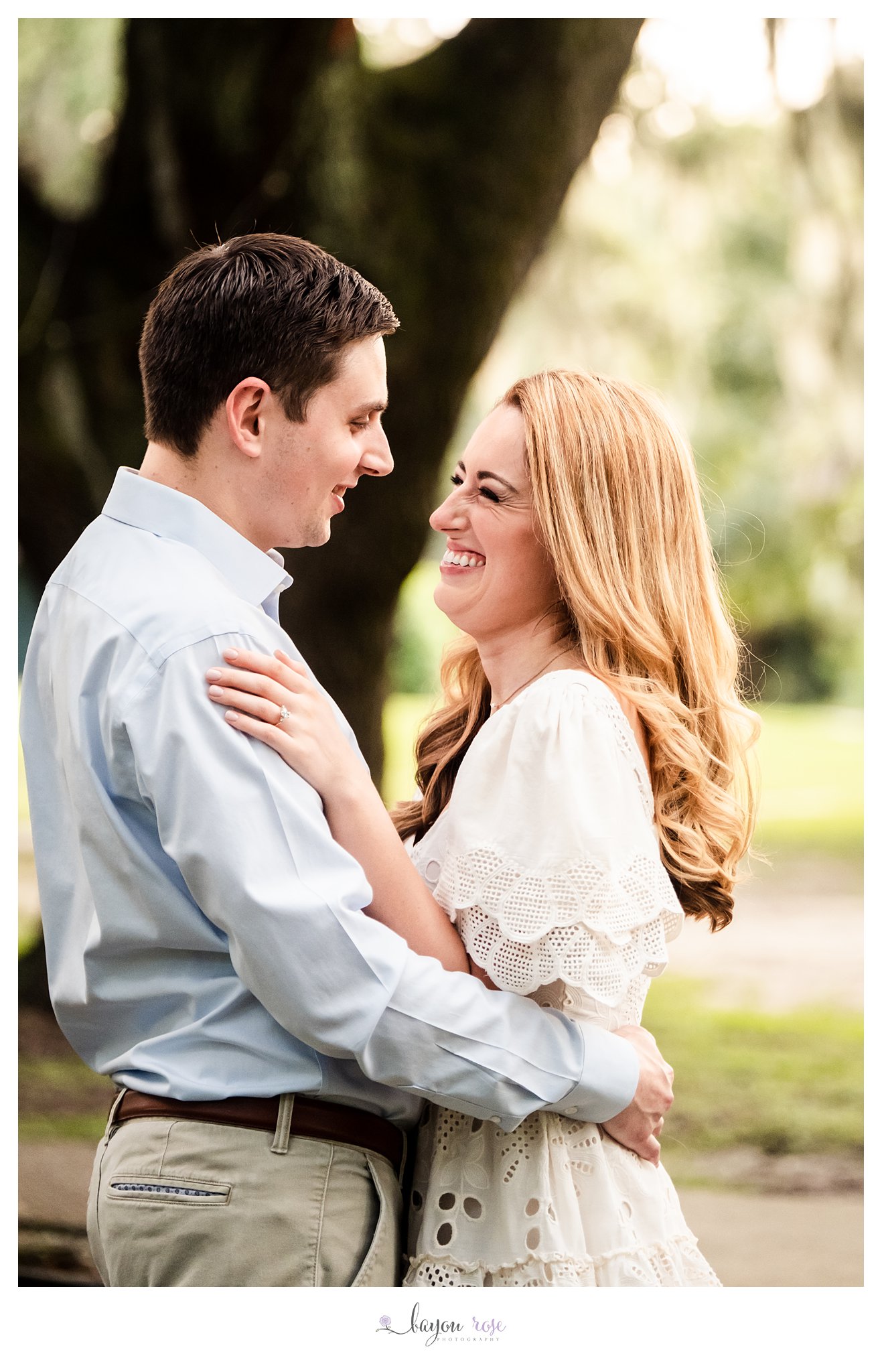 engagement photo of woman laughing with her fiance