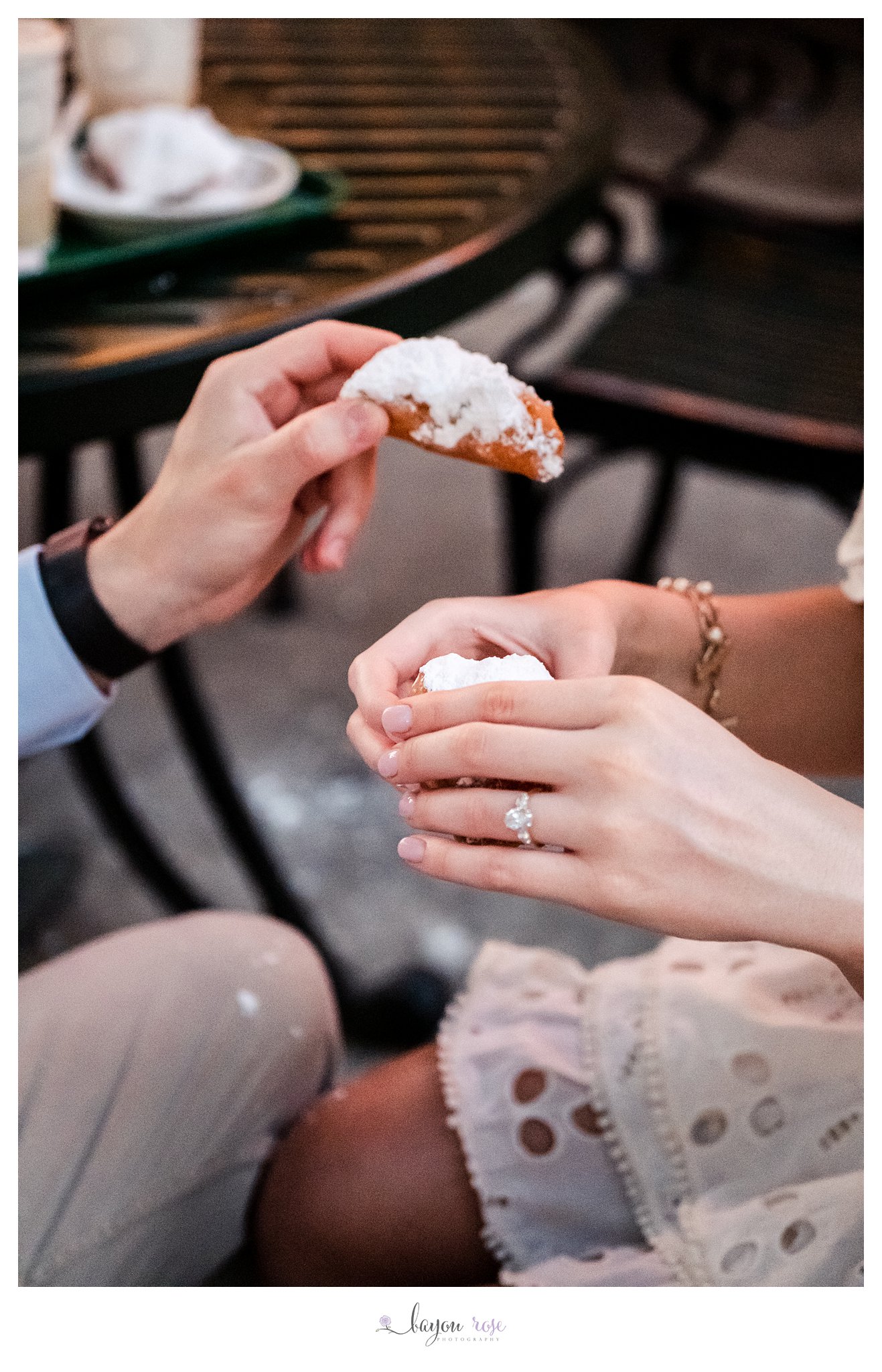 Cafe du Monde engagement photo couple holding beignets