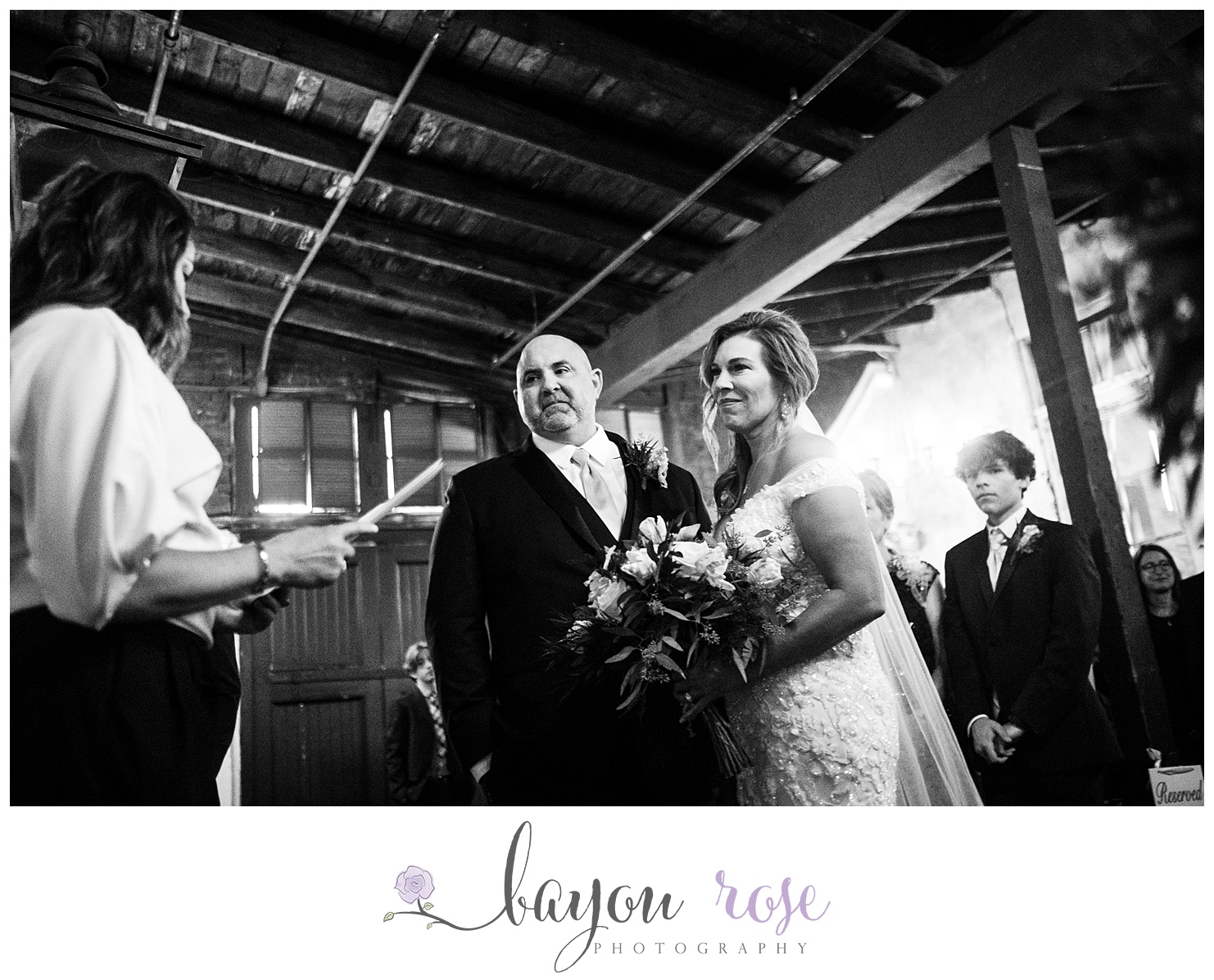 black and white photo of bride and groom at wedding ceremony at Latrobe's on Royal