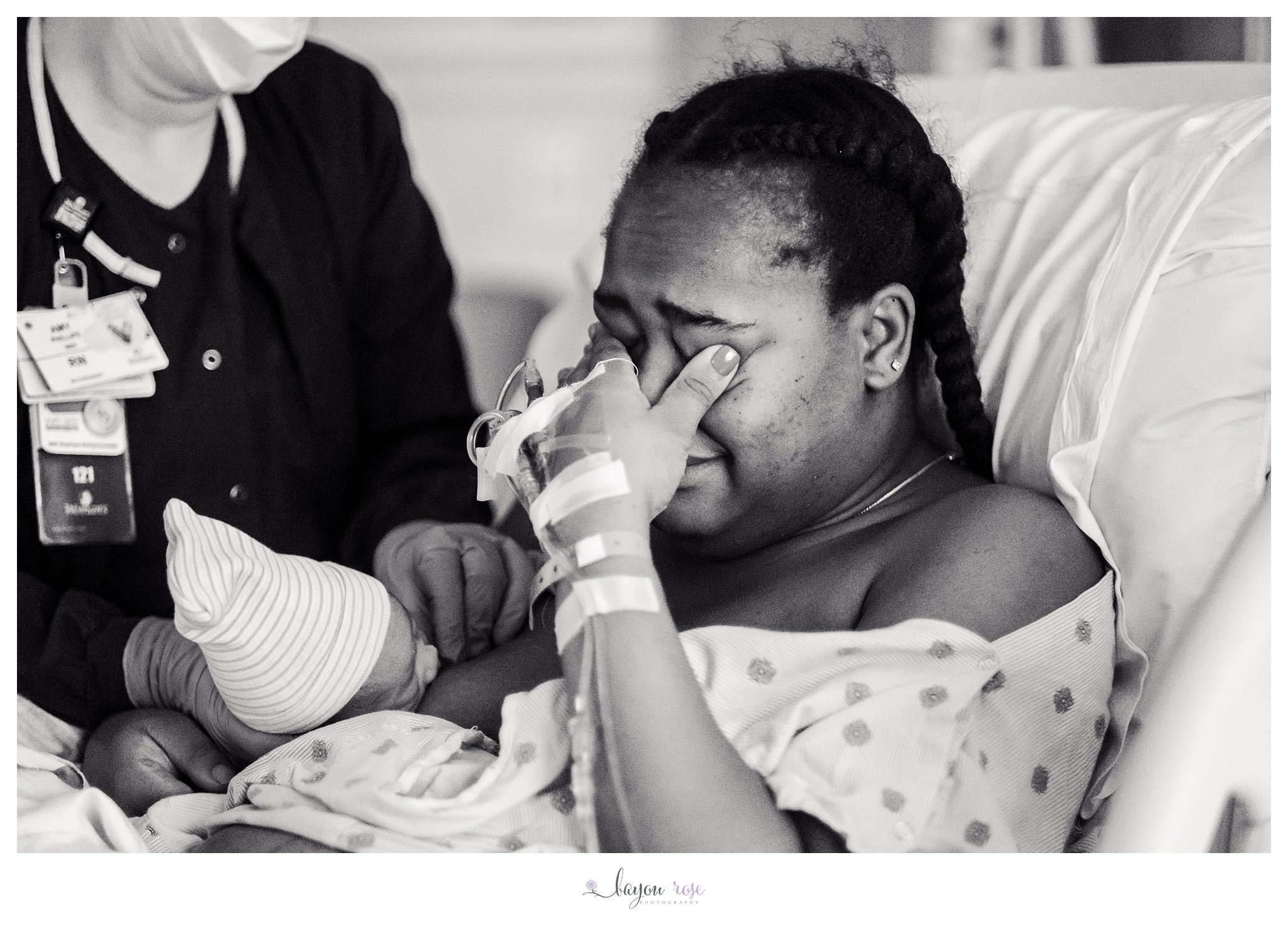 mom overcome with emotion after natural childbirth at Woman's Hospita